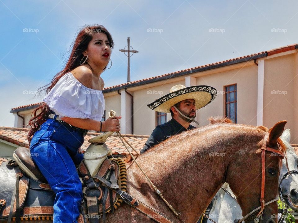 Gorgeous Cowgirl Riding A Horse
