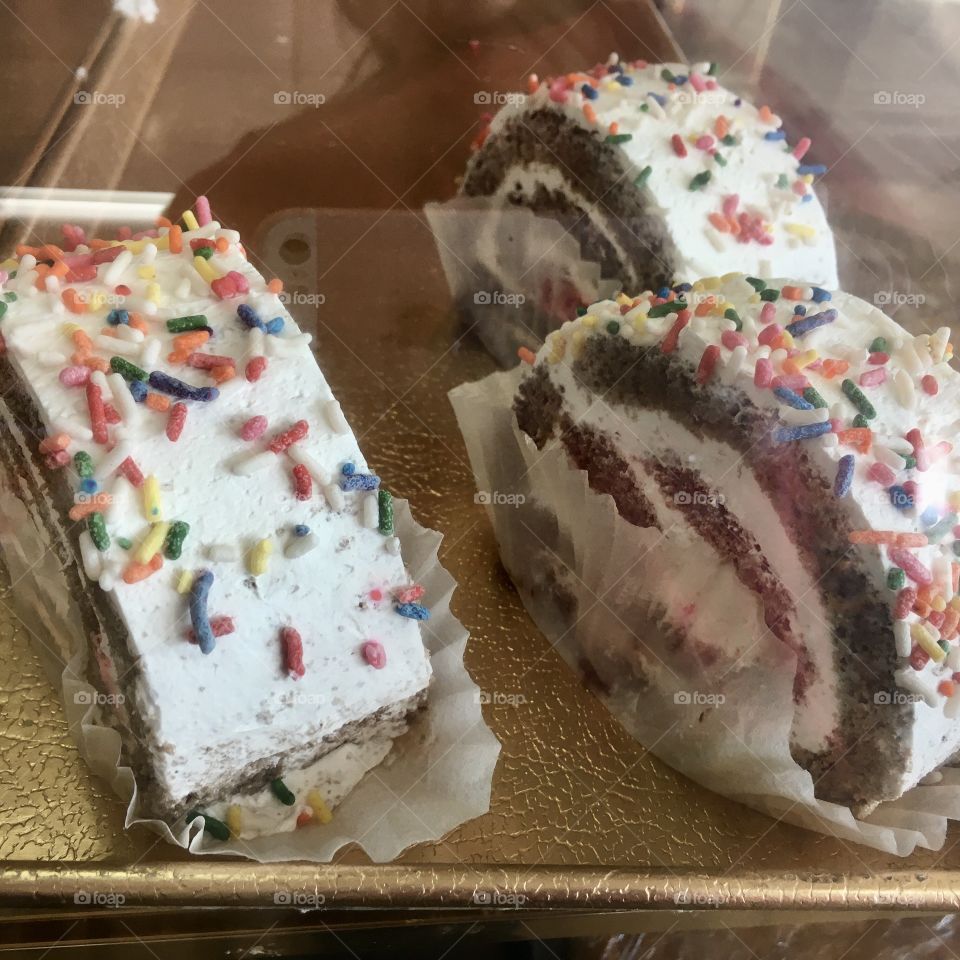 Delicious cake rolls with sprinkles 