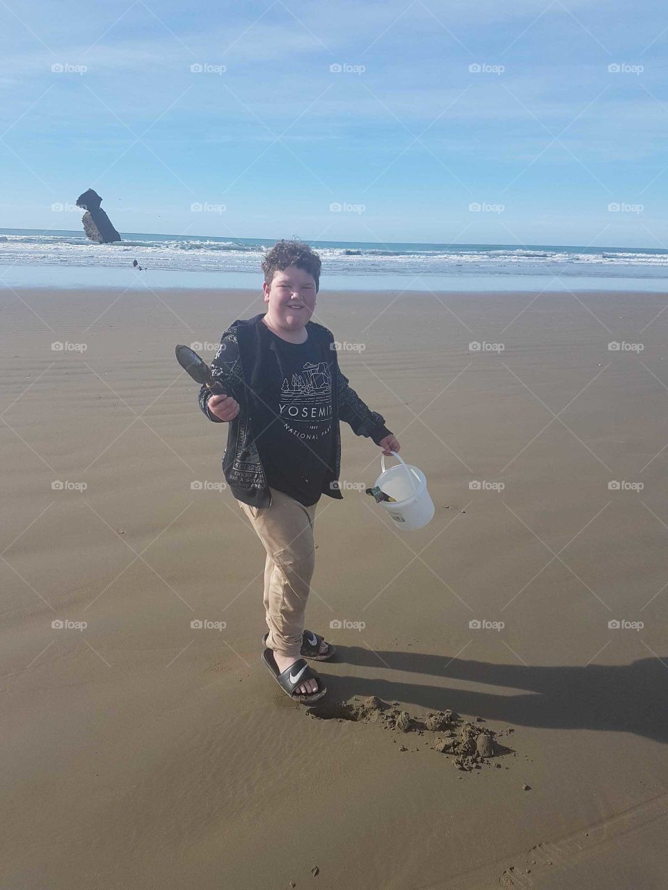 Original pic of my son. Capturing a moment when the sand is flung into the air. A beautiful summer day.