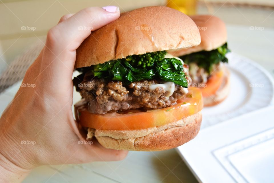 Close-up of burger in hand