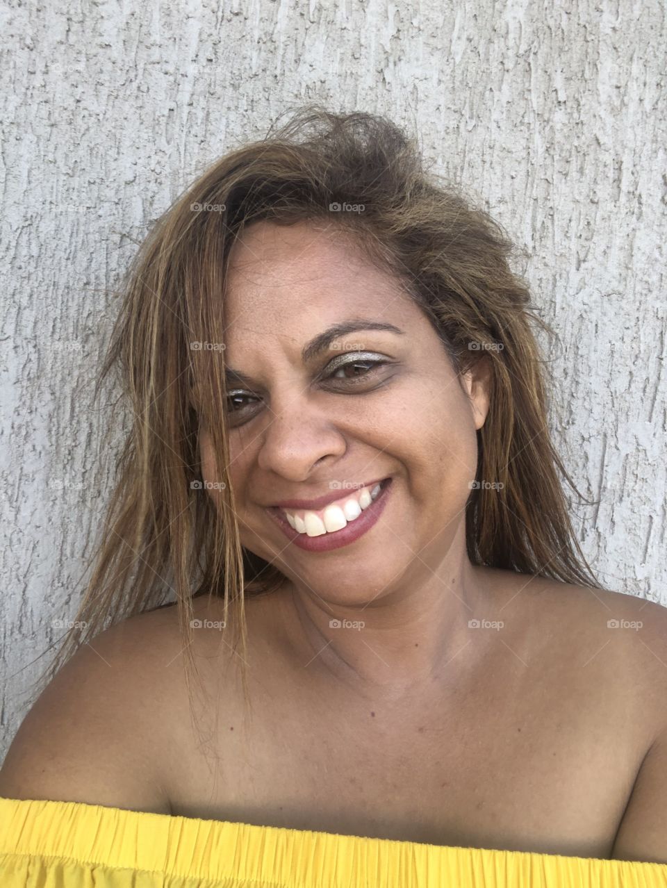 Woman standing against the wall 