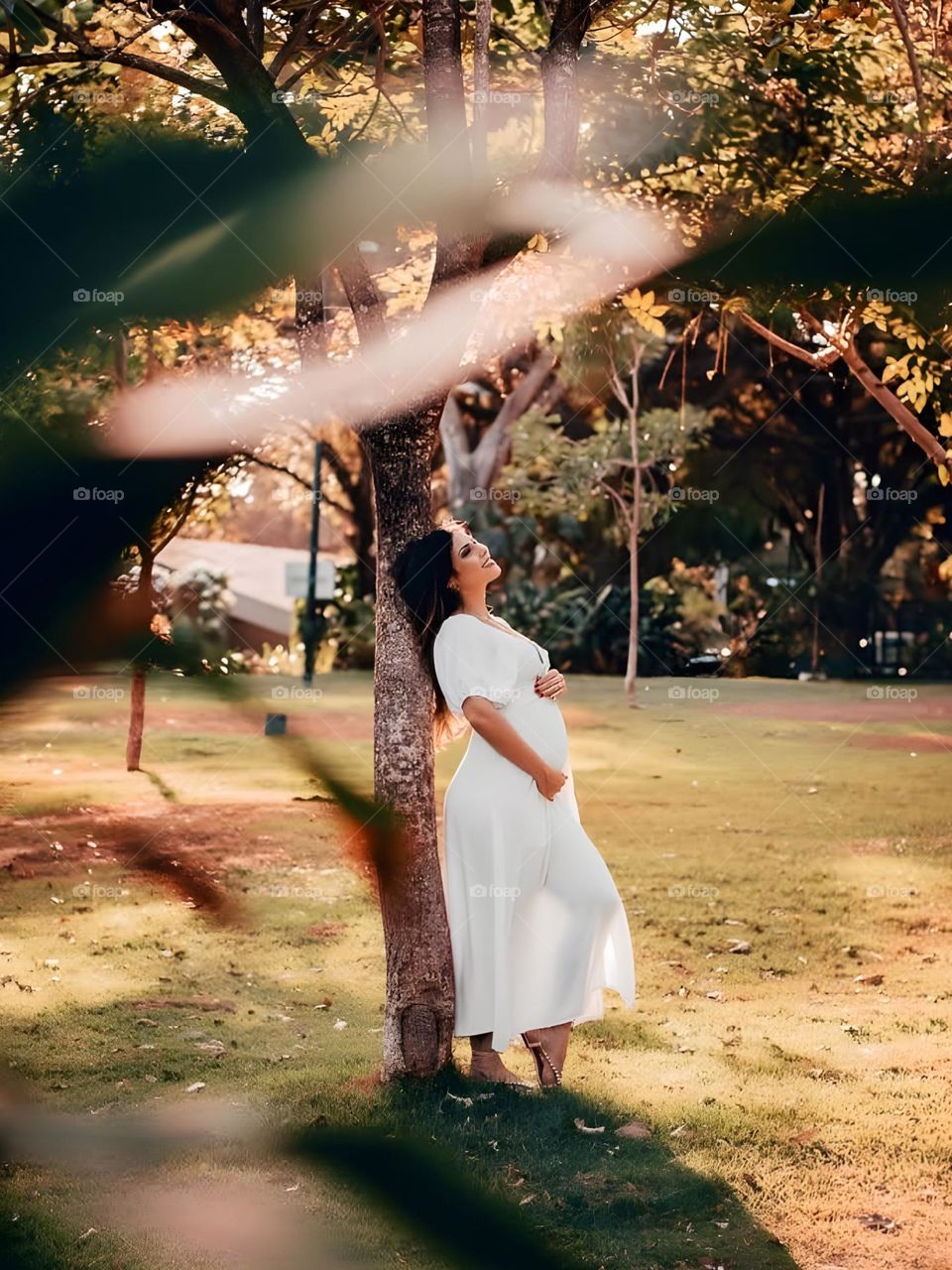 Pregnant woman feeling peaceful amidst nature