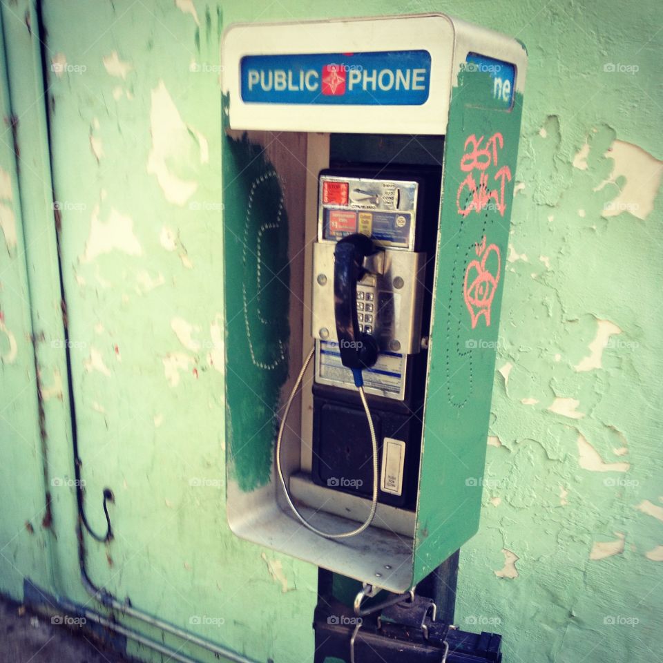 Pay phone . A rare find showcasing a coin-operated phone.