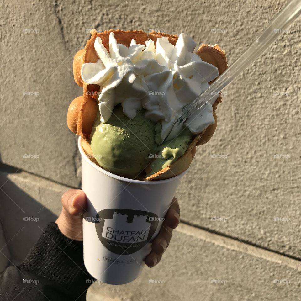 Eggwaffle with matcha ice cream and cream in Milan. Perfect for the weather, soft and fresh! New way to eat the ice cream with a waffle