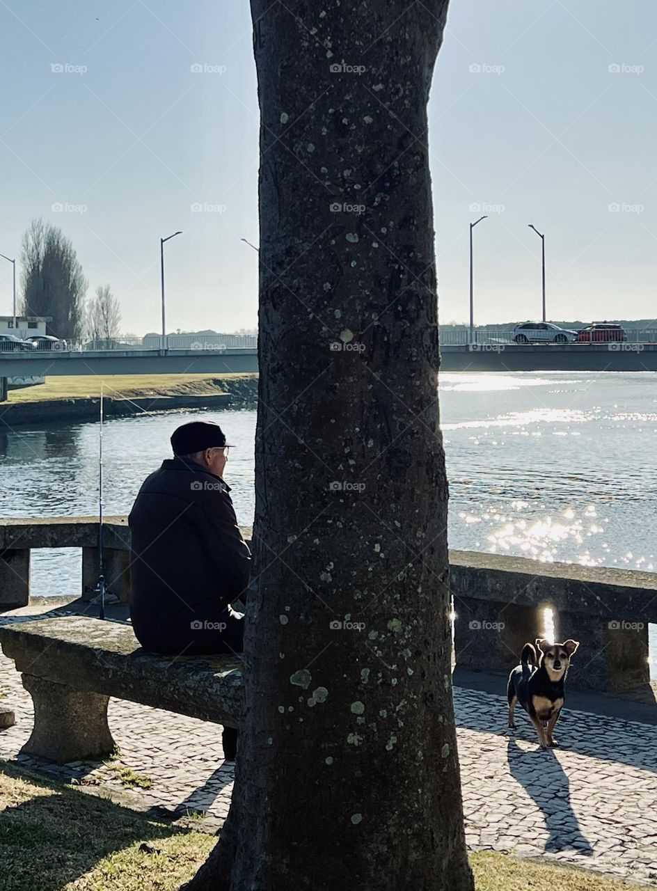 Dog and owner by the river 