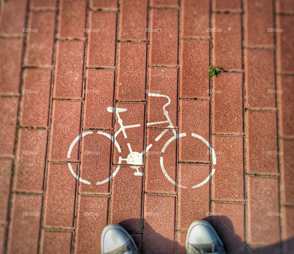 High angle view of bicycle road sign
