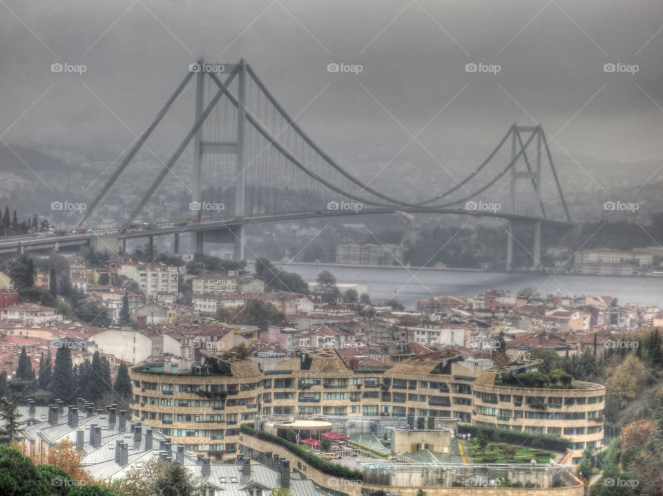 Istanbul Bosphorus Bridge. During fall view of Istanbul Bosporus Bridge with big  Turkish and North Cyrus Turkish Republic flags.