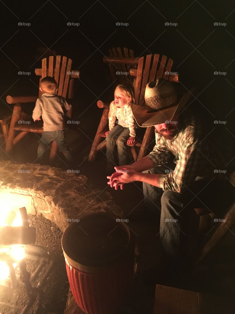 Cowboy & kids by a campfire