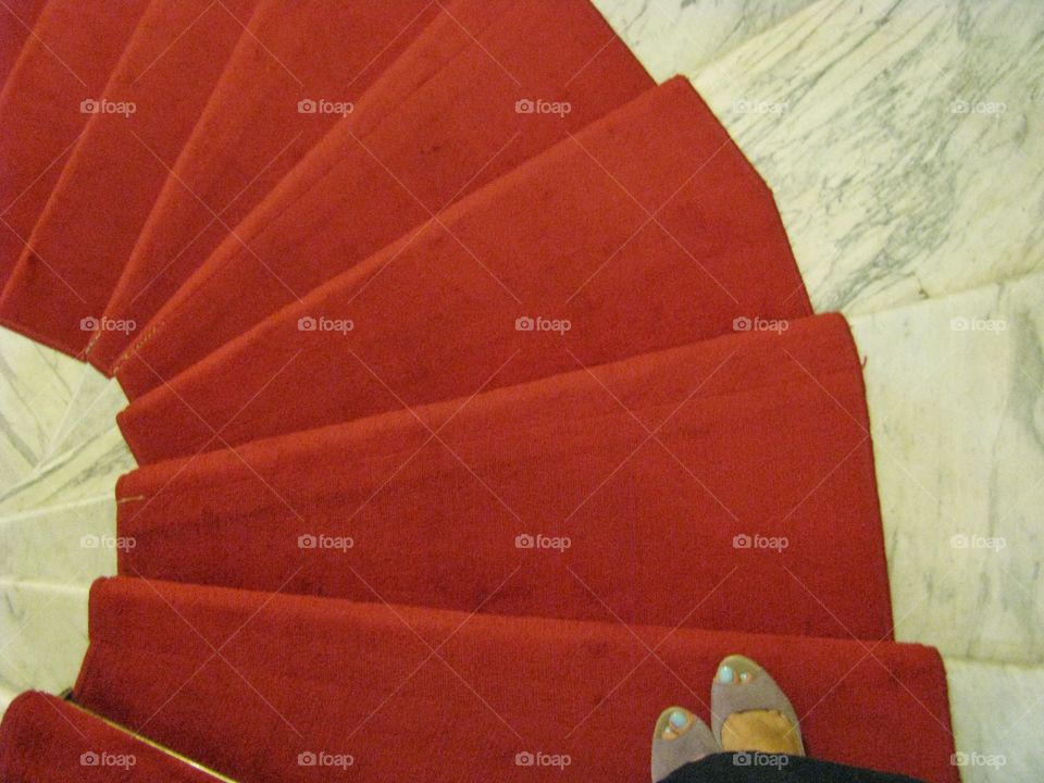 Red carpet on a round staircase 