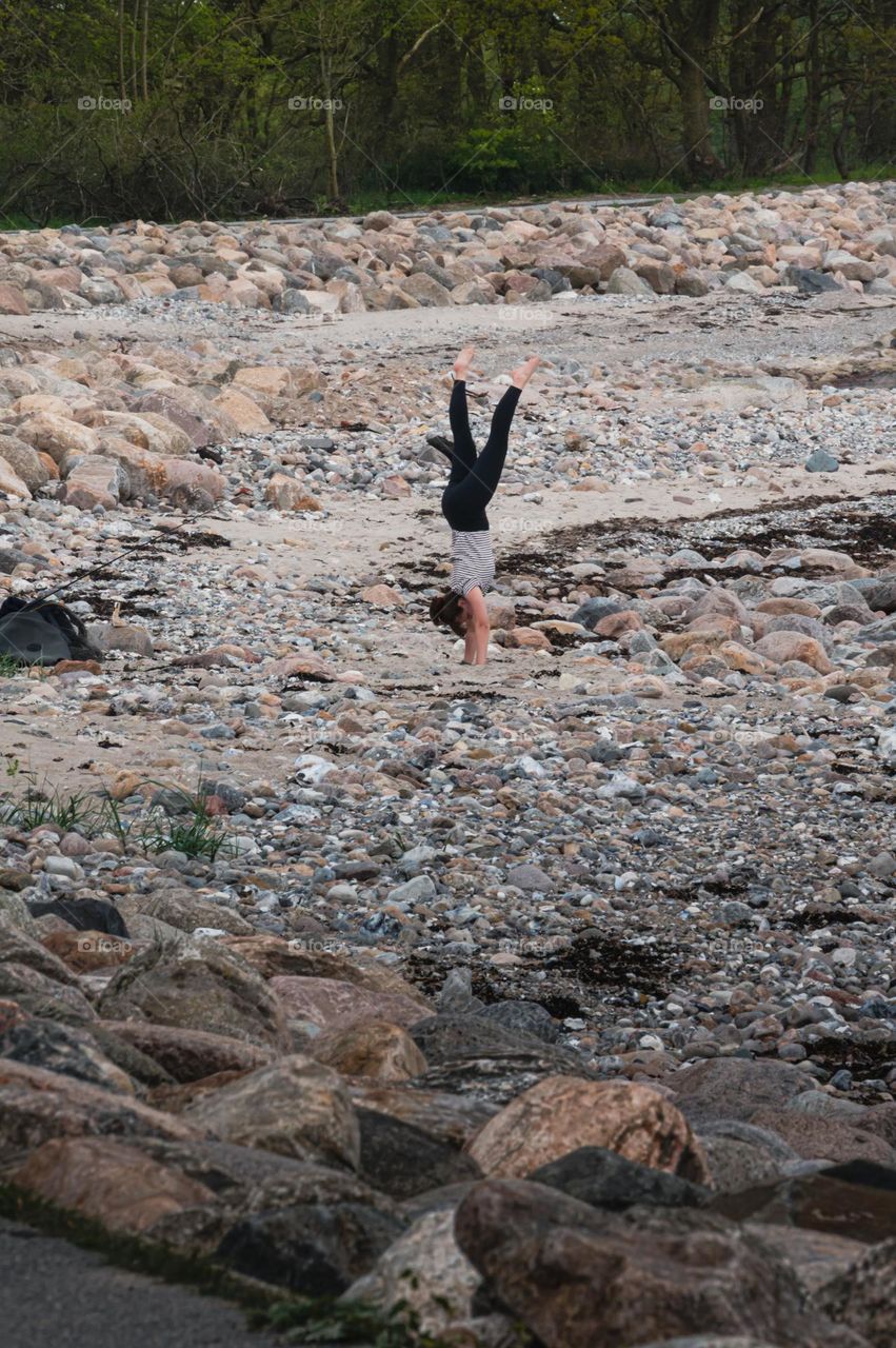 handstand between rocks and stones