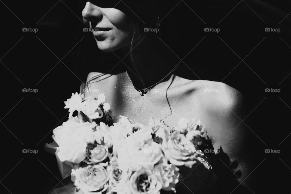 Girl with flowers. Black and white photography