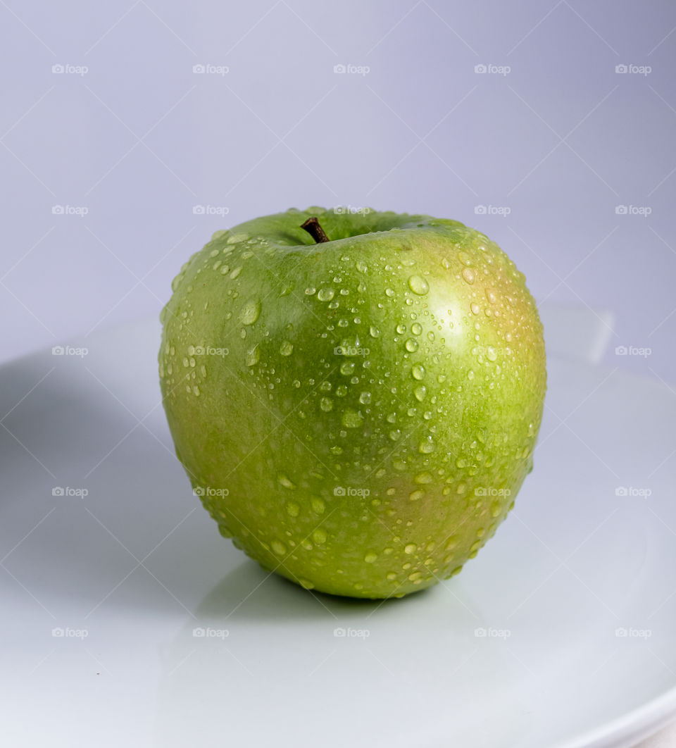 Fresh apple with raindrops 