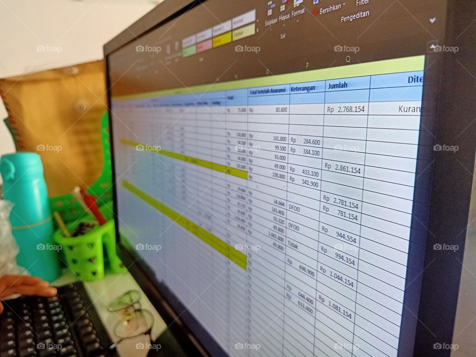 Inputting sales data in online business via laptop