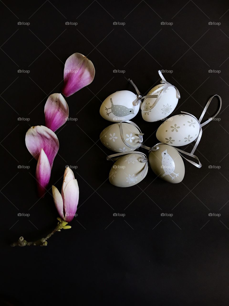 High angle view of petals and easter eggs