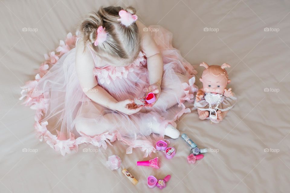 girl playing with dolls