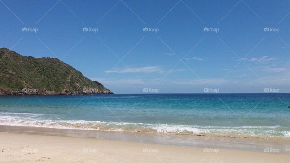 Cata Bay, a beach with blue sea, golden sands, and a splendid sky.  A delight for tourists and visitors