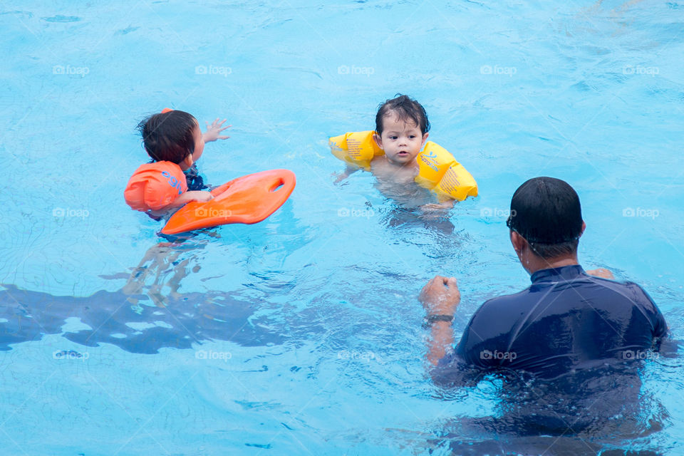 infant in swimming poor