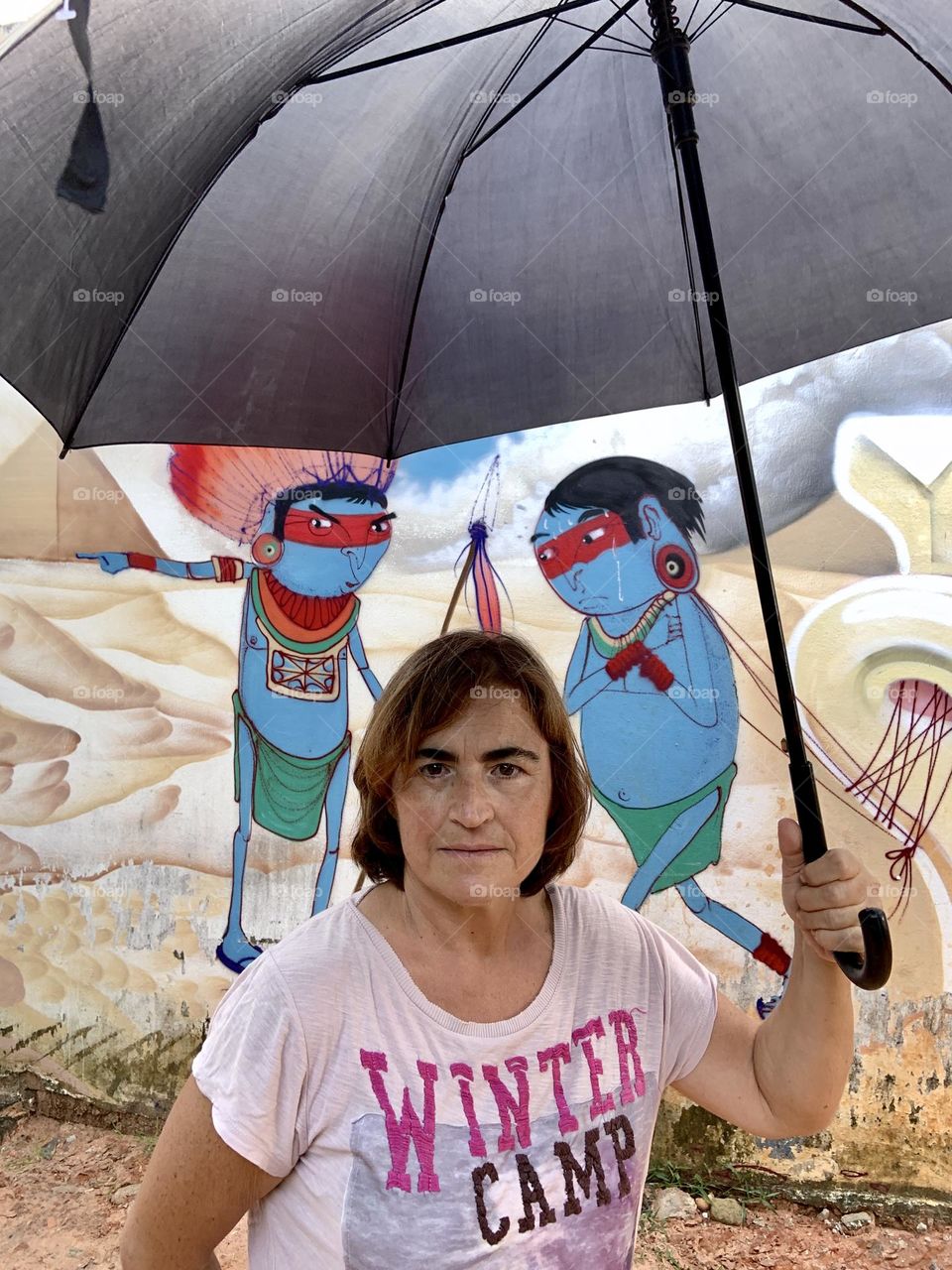 Woman with umbrella and blue Indian 