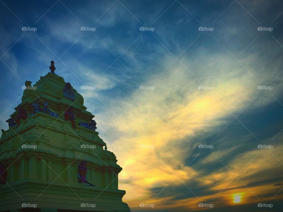Indian temple silhouette at sunset