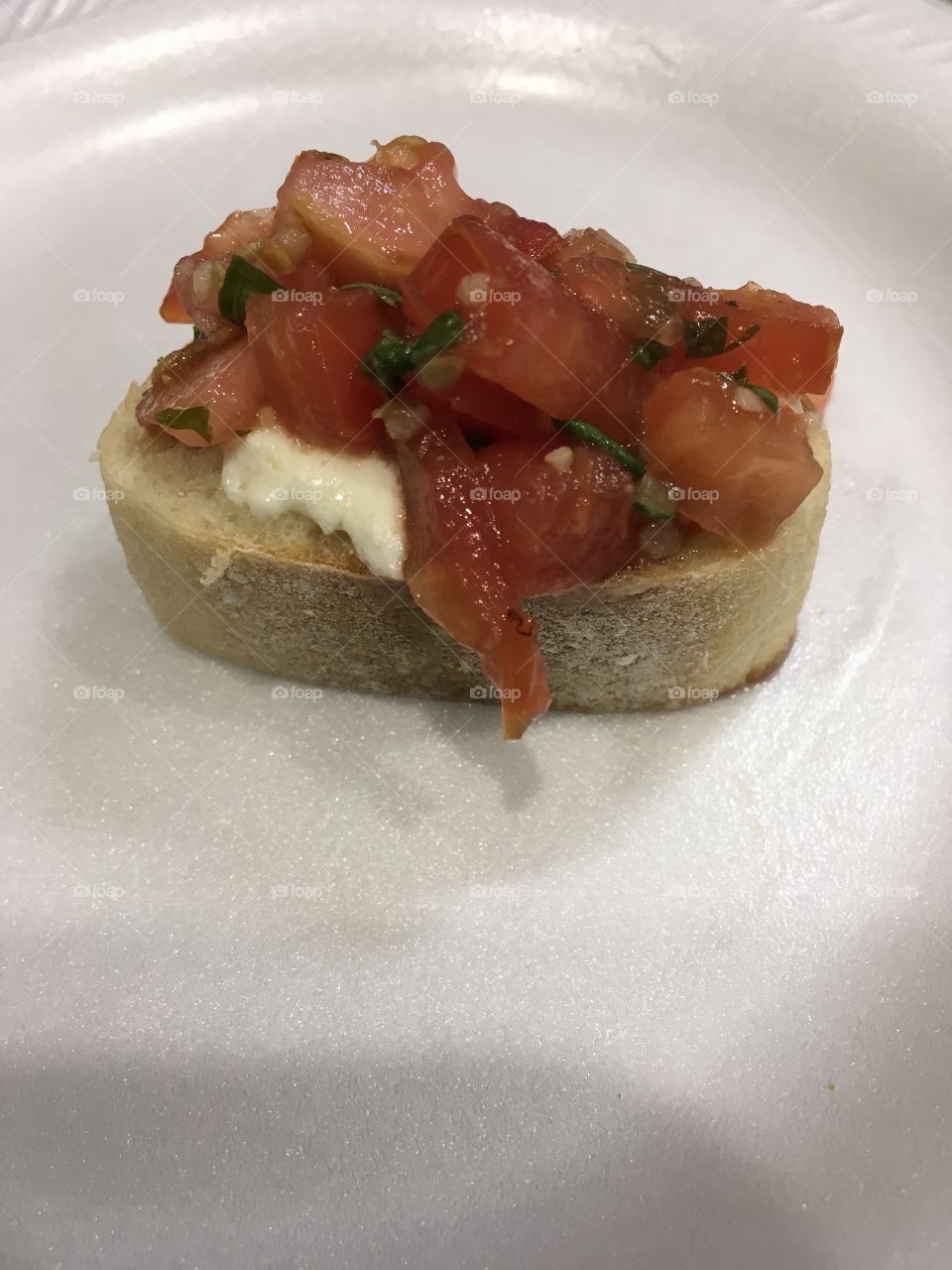 Homemade Bruschetta with melted cheese on French bread
