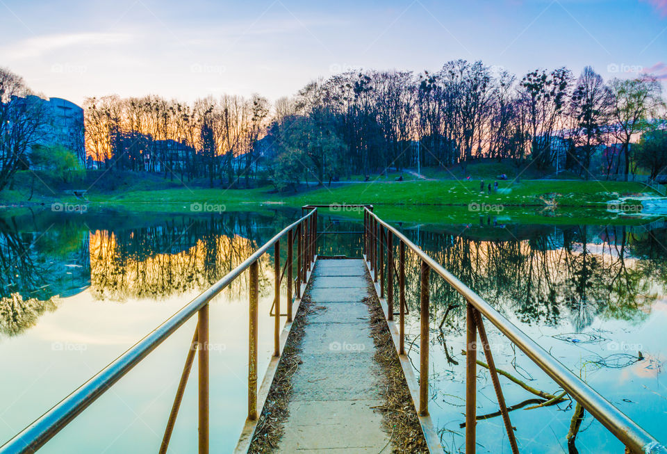 city park with lake in the spring season