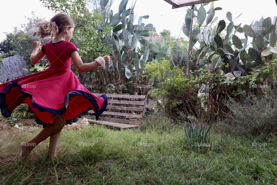 Girl dancing at back yard 