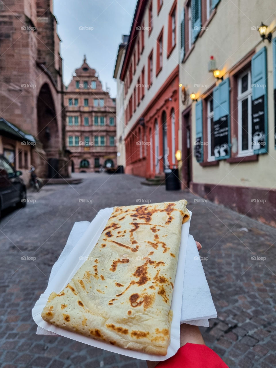 Eating a warm crepe in a new town, that makes me smile. It makes me smile to visit a new place to eat somethings warm after a long day of walking, seeing a new places. When you had a great day and you eat something warm, reflect on your adventure.
