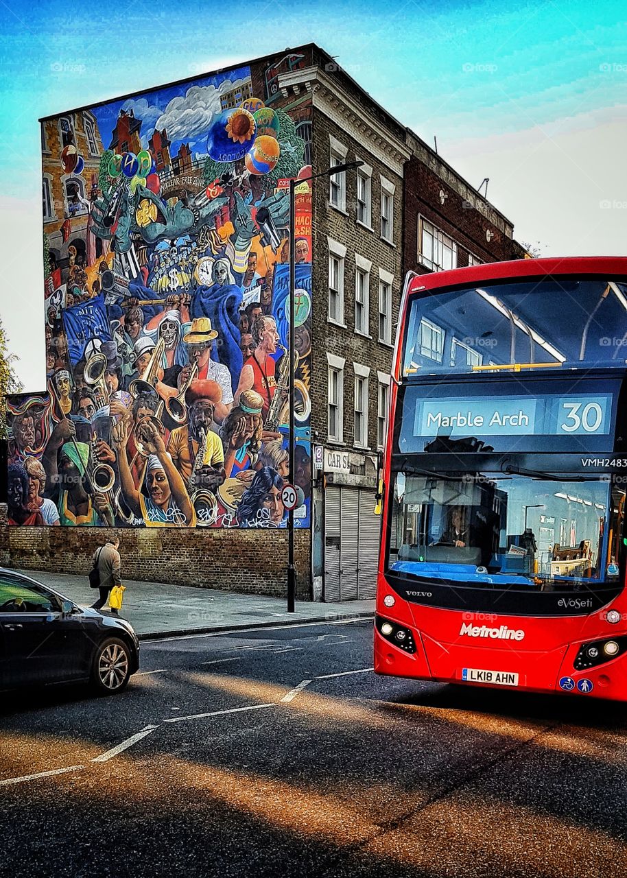 London bus with wall art