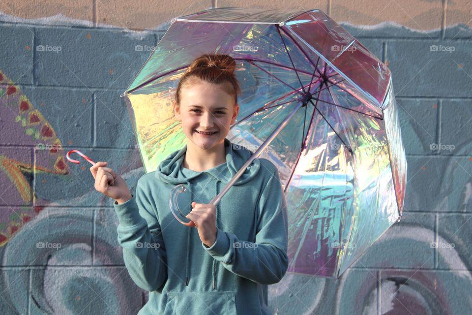 Girl holding Iridescent umbrella