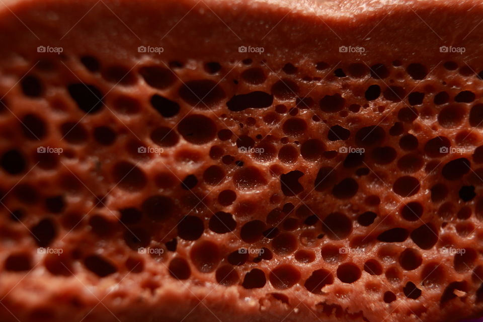 a bubbly chocolate under macro lens