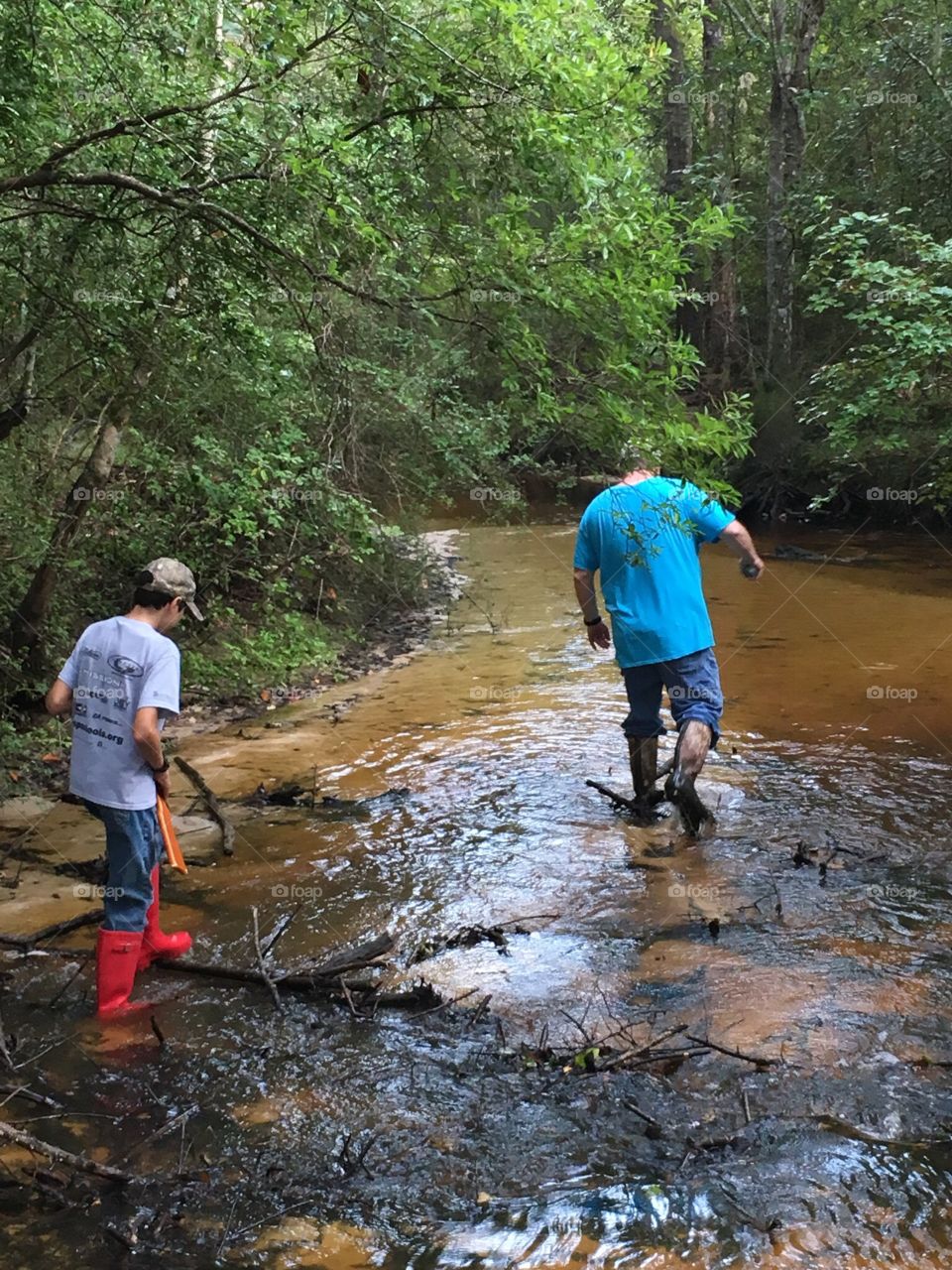 Father and son exploring the creek. They had a blast! 