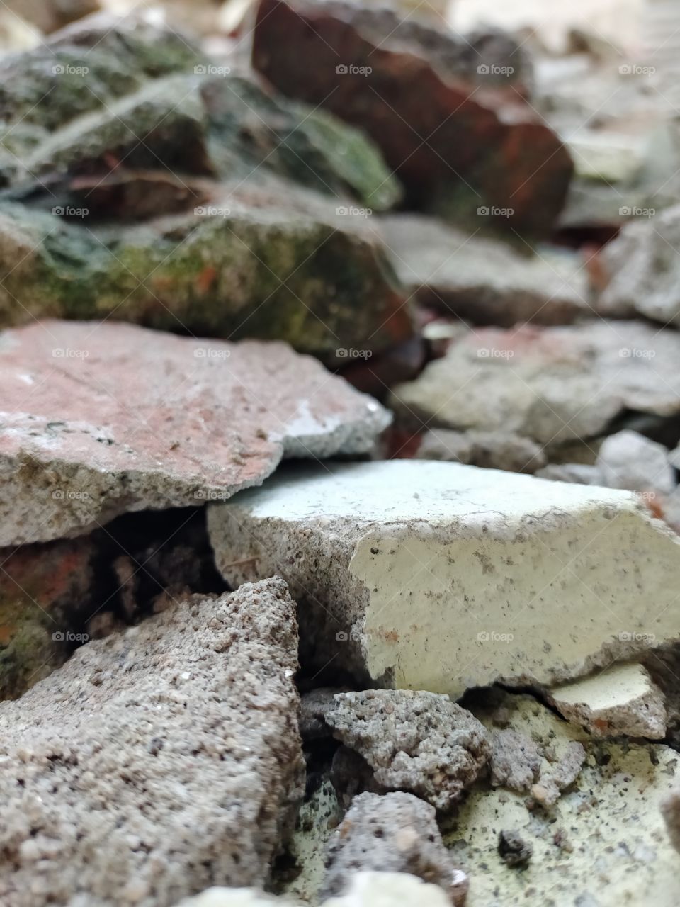 Broken parts of solid cement . also used in science book to show solid cement.