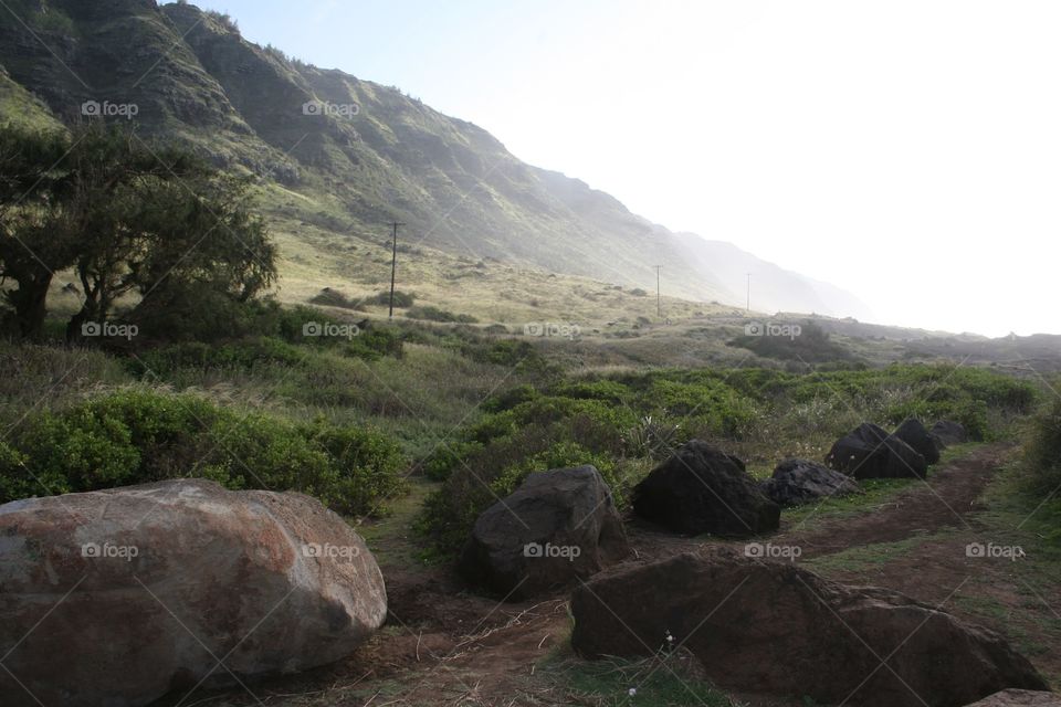 Hills, Rocks & Telephone Poles. Trail on the way to Kaena Point on Oahu , Hawaii.