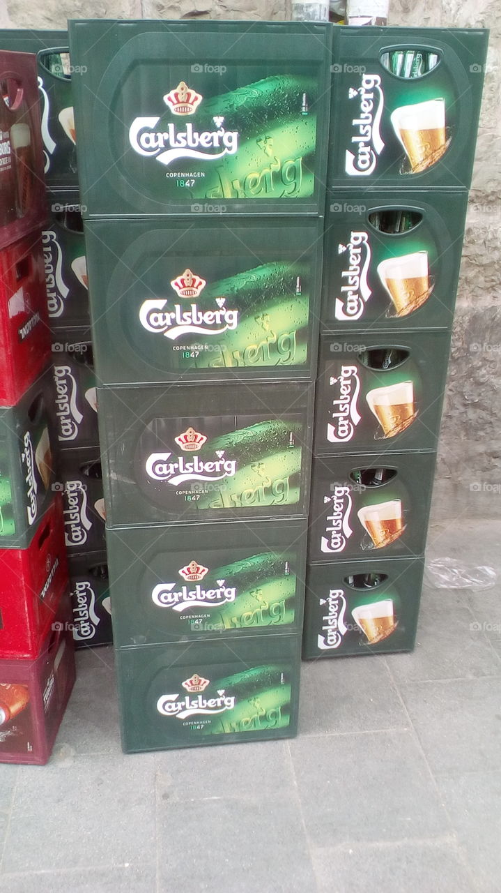 Stock of Carlsberg box beer in street