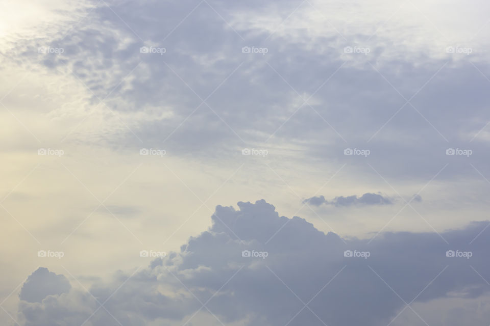 The beauty of the sky with clouds and the sun in summer.