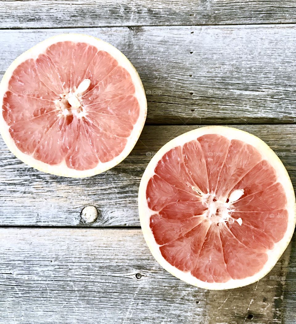High angle view of halved grapefruit
