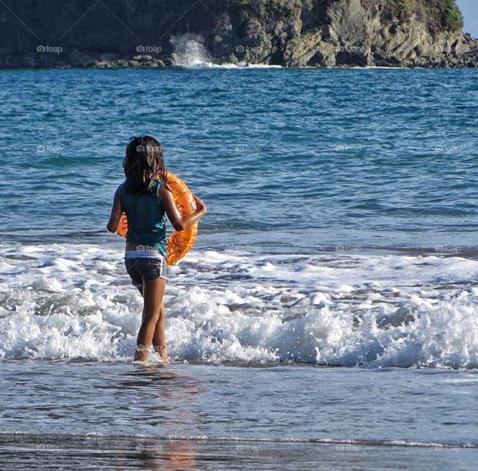 Girl playing on the beach