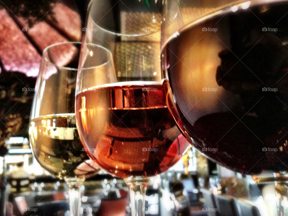 Red, rose and white wine on restaurant table