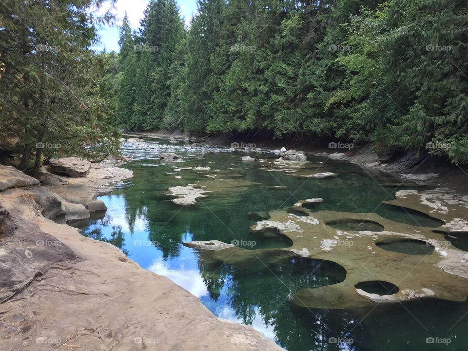 Cold green glacier-fed river is a great place to swim and play on a hot summer day!