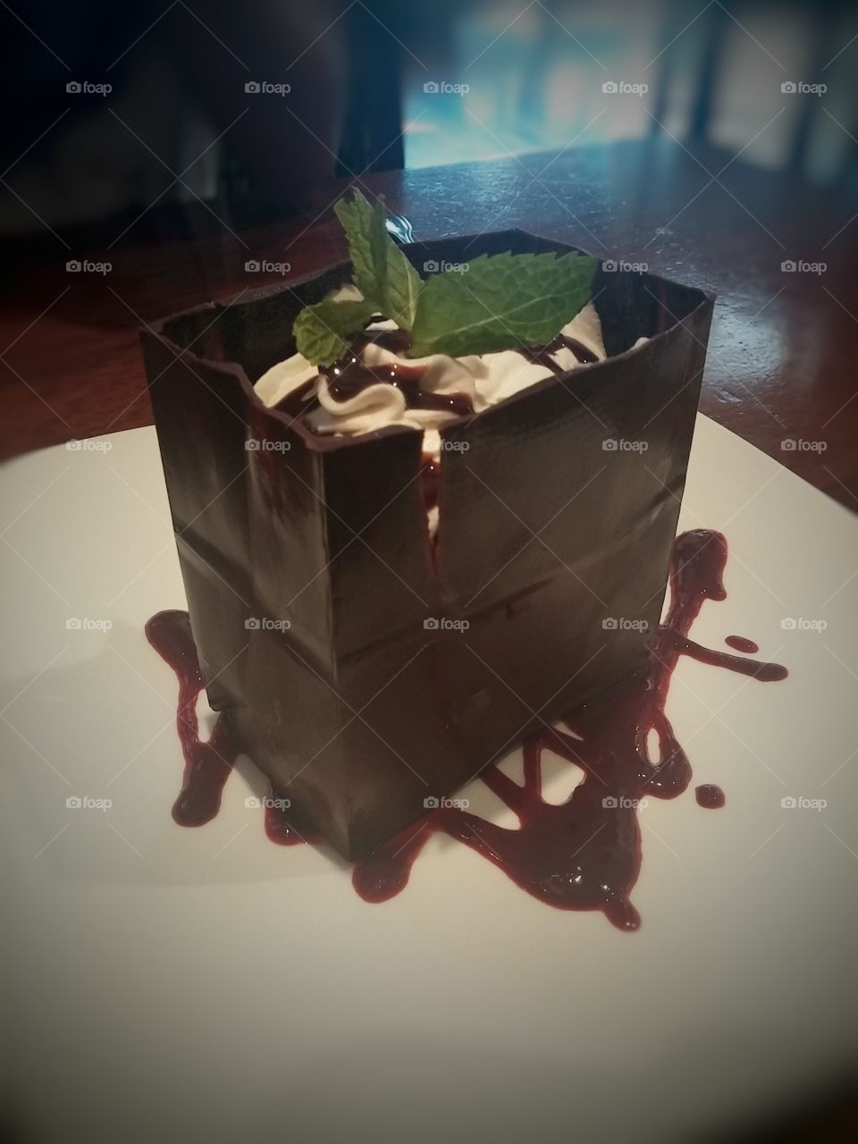 Chocolate Bag. Walls of chocolate that forms a bag filled with mousse and berries.
