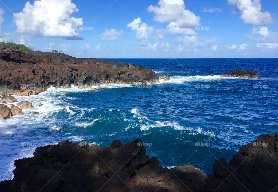 Blue skies, waves, and lava