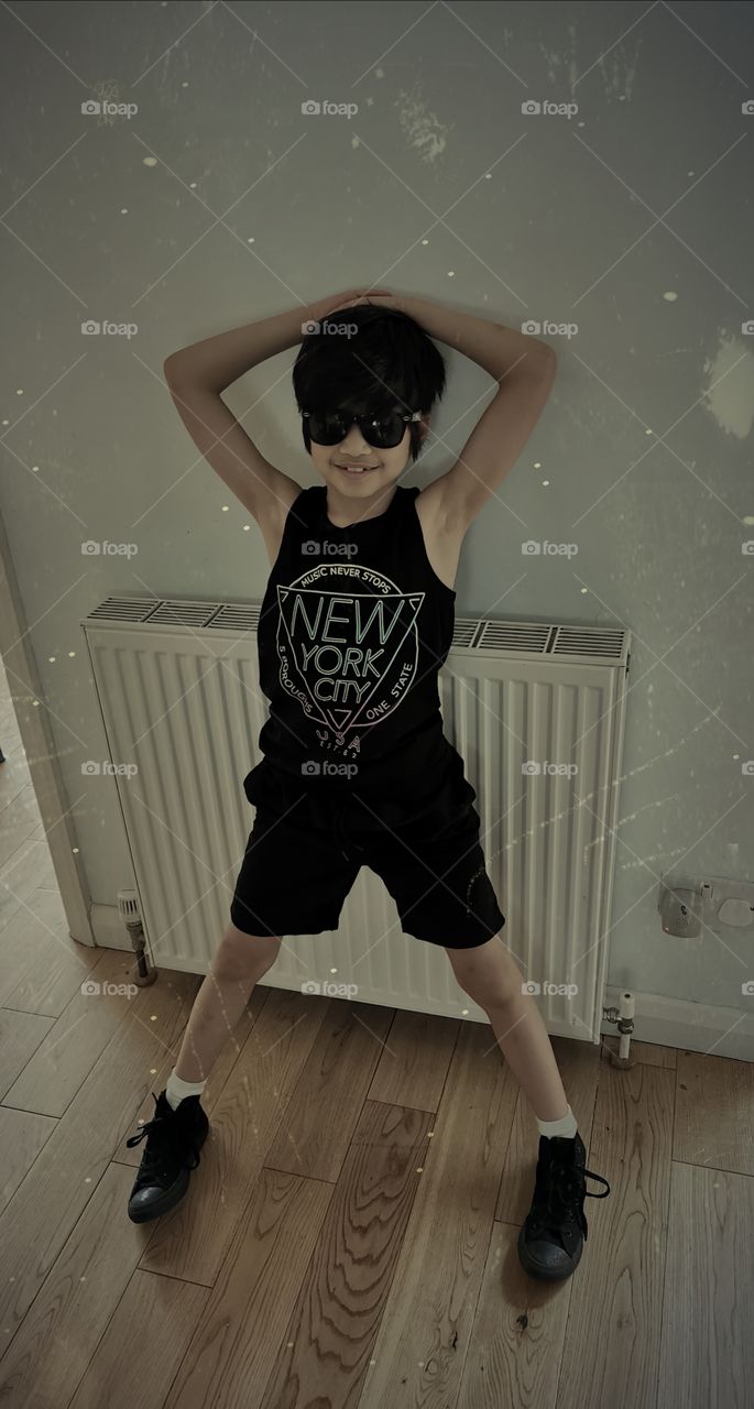 Boy in black - New York City vest and sunglasses
