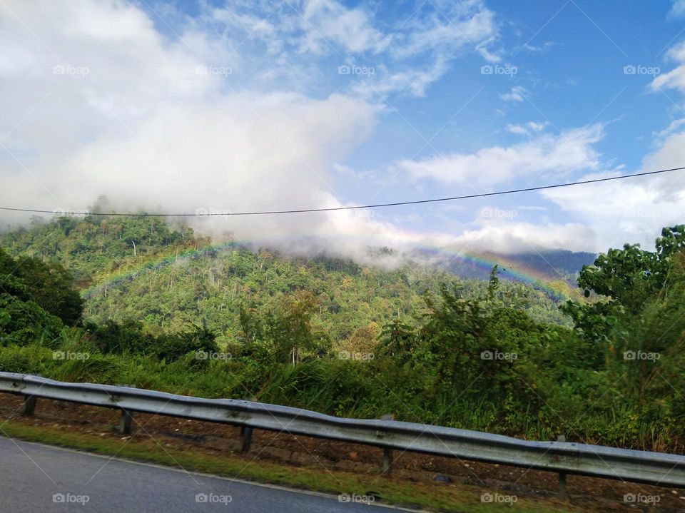 Rainbow beside the road.