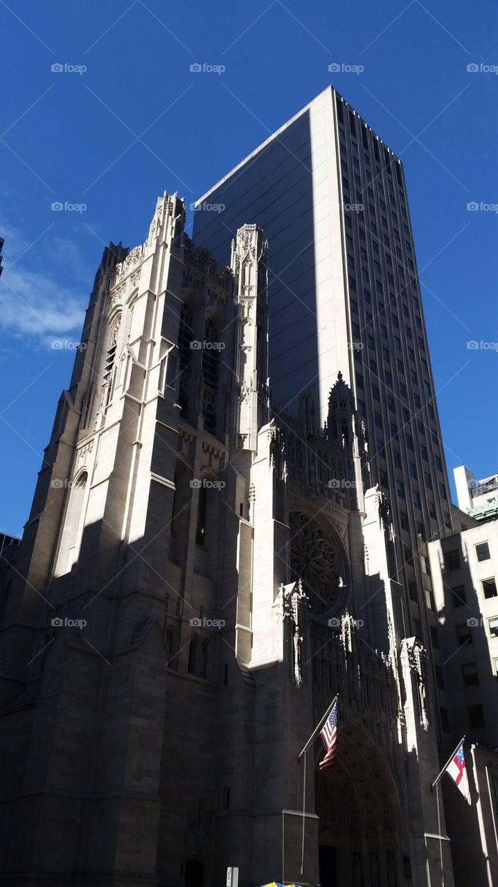 church next to skyscraper, NYC