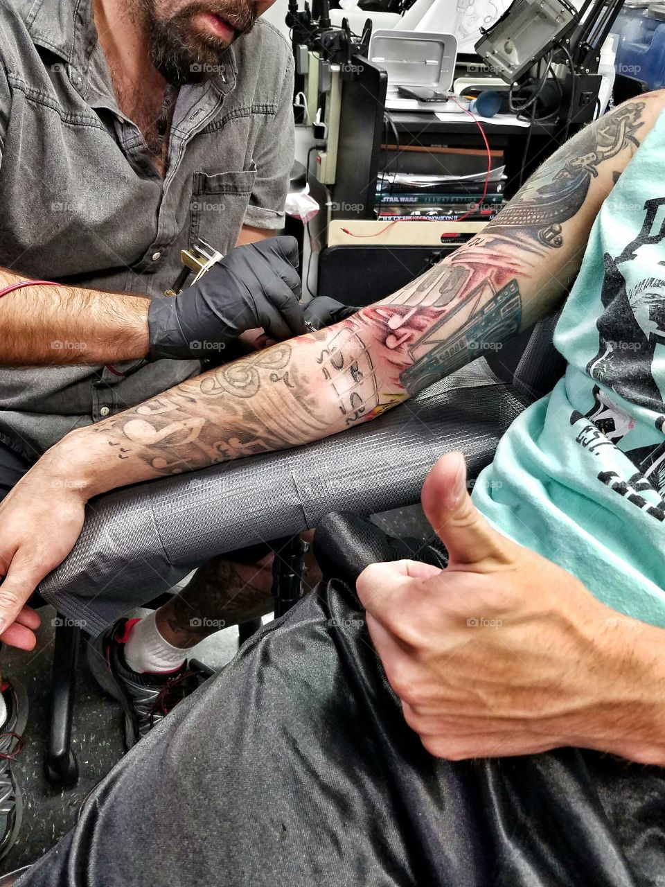 My best friend getting his tattoo sleeve finished.