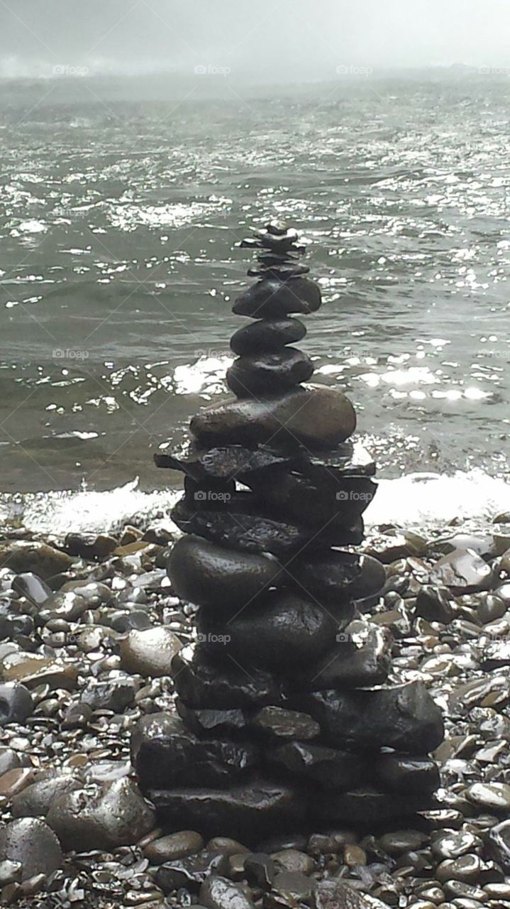 Cairn by the water's edge