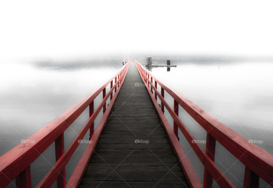 Dock on a west coast beach at low tide. 
