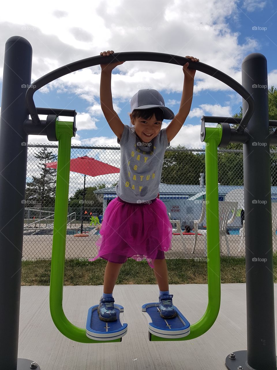 Cute girl in an outdoor gym