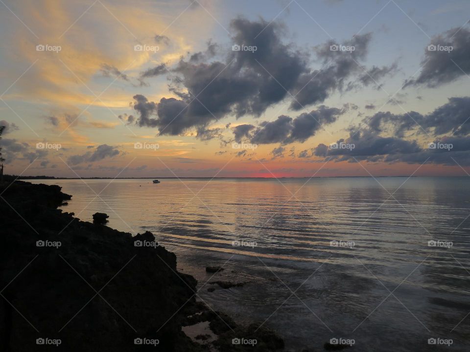 Pastel beach sunset with clouds