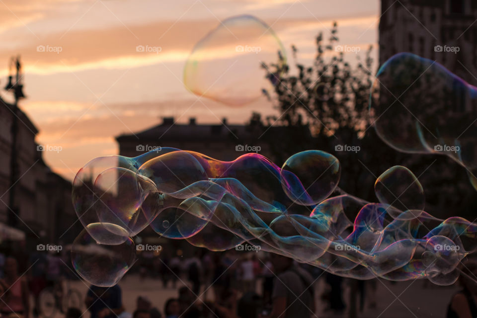 Bubbles in the street at sunset